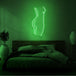 Neonlamp van vrouwen lichaam in kleur groen