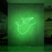 Neonlamp van papieren vliegtuig in kleur groen