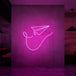 Neonlamp van papieren vliegtuig in kleur roze