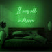 Neon letters met tekst "It was all a dream" in kleur groen