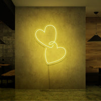 Neonlamp van hartjes in kleur geel