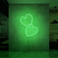 Neonlamp van hartjes in kleur groen