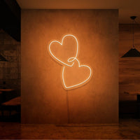 Neonlamp van hartjes in kleur oranje