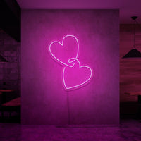 Neonlamp van hartjes in kleur roze