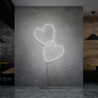 Neonlamp van hartjes in kleur wit