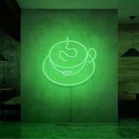 Neonlamp van een kop koffie in kleur groen