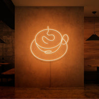 Neonlamp van een kop koffie in kleur oranje