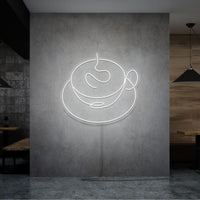 Neonlamp van een kop koffie in kleur wit