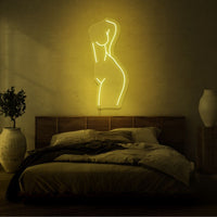 Neonlamp van de voorkant van een vrouw in kleur geel