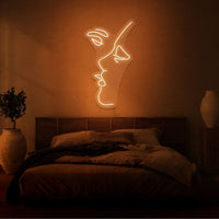 Neonlamp van mond die kust in kleur oranje