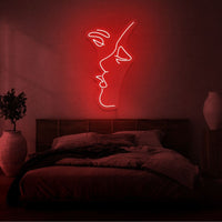 Neonlamp van mond die kust in kleur rood