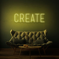 Neon letters met tekst "Create" in kleur geel