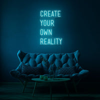 Neon letters met tekst "create your own reality" in kleur cyaan