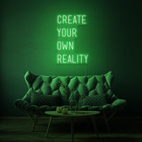 Neon letters met tekst "create your own reality" in kleur groen
