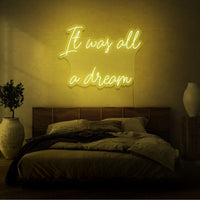 Neon letters met tekst "It was all a dream" in kleur geel