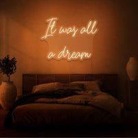 Neon letters met tekst "It was all a dream" in kleur oranje
