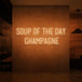 Neon letters met tekst "Soup of the day: champagne" in kleur oranje