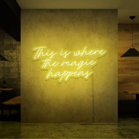 Neon letters met tekst "This is where the magic happens" in kleur geel